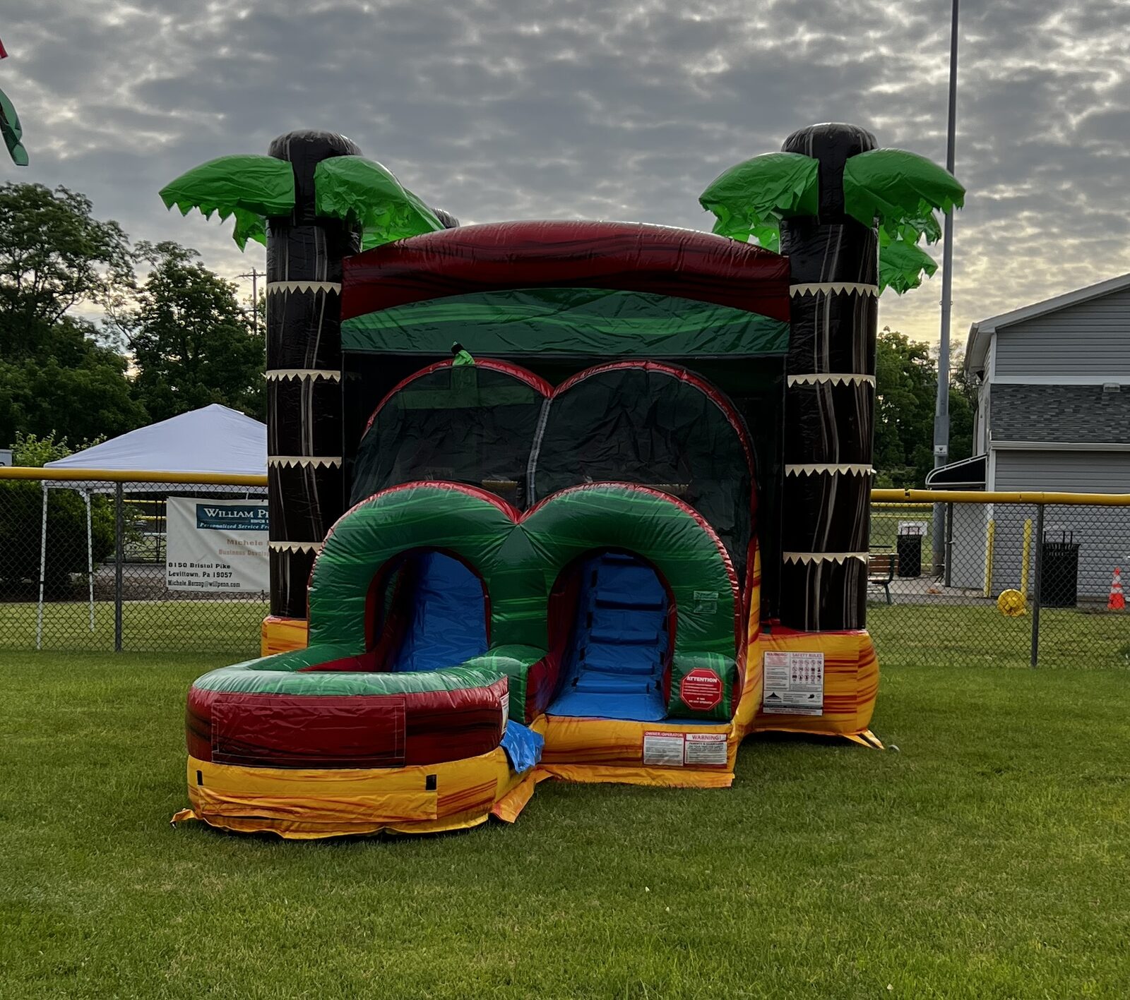 Tropical wet and dry combo bounce house with slide rental