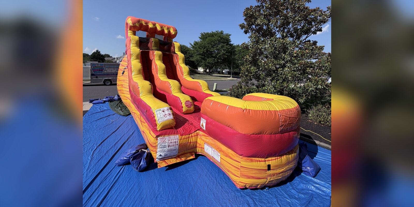 Inferno 15 foot inflatable water slide with splash pad, available to rent in Bucks County PA